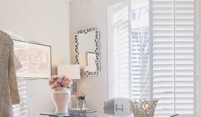 Plantation shutters in a home office.